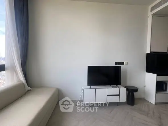 Modern minimalist living room with sleek furniture and natural light