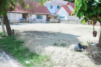 Vacant land plot with potential for residential development, surrounded by houses in a serene neighborhood.