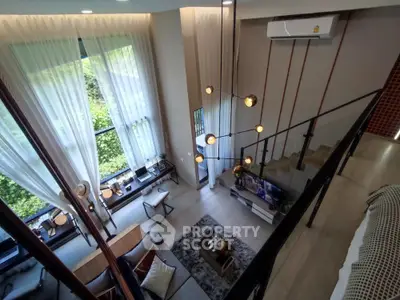 Luxurious modern living room with high ceilings and large windows offering a stunning view.