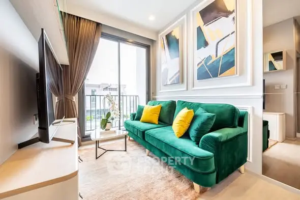 Stylish living room with green sofa, modern decor, and balcony view in a contemporary apartment.