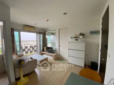 Modern living room with balcony view in high-rise apartment