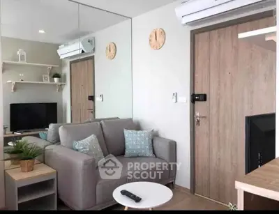 Modern living room with stylish decor and air conditioning in a cozy apartment.