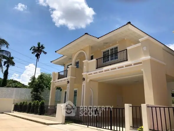 Elegant two-story house with spacious balcony and modern design in a serene neighborhood.