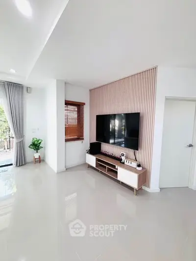Modern living room with sleek TV setup and stylish decor