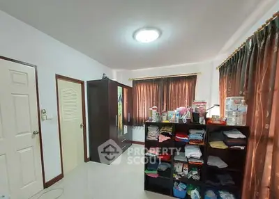 Spacious bedroom with ample storage and natural light