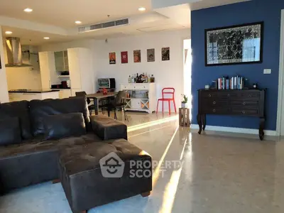 Spacious modern living room with stylish decor and open kitchen layout