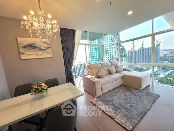 Luxurious living room with chandelier and stunning city view