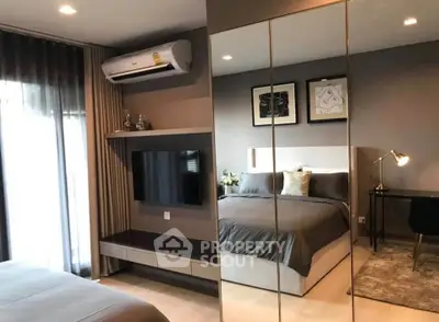 Modern bedroom with mirrored closet and stylish decor