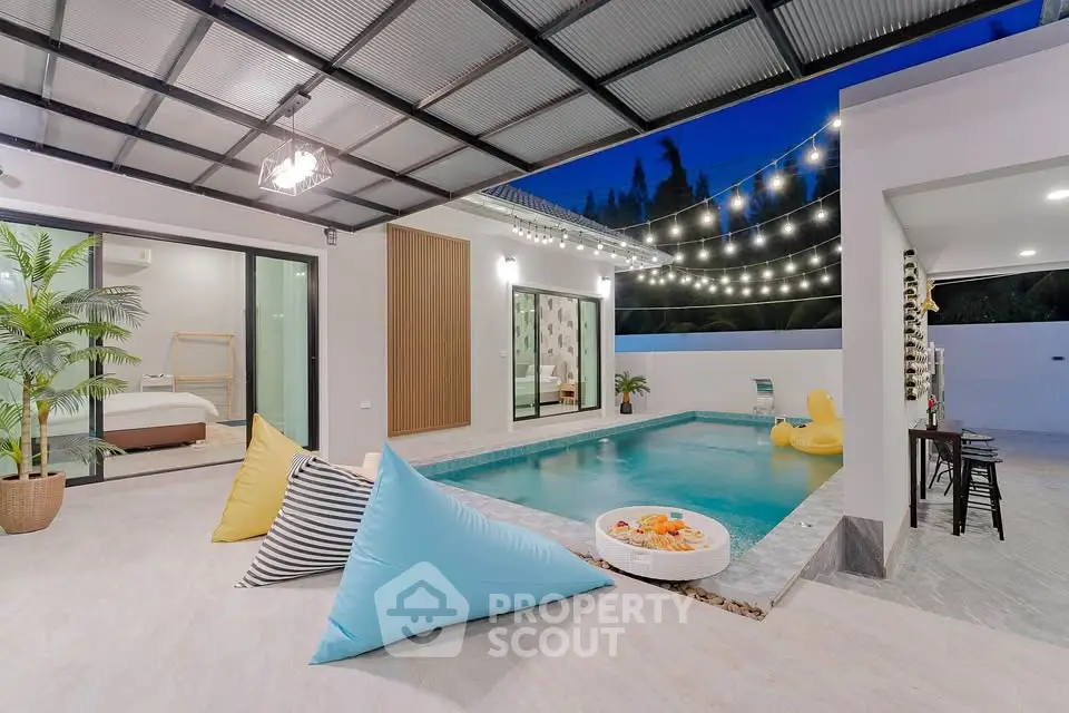 Luxurious modern villa with private pool and stylish outdoor seating area, perfect for relaxation and entertainment.