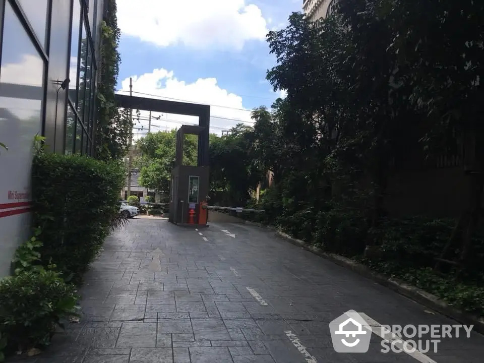 Charming residential entrance with lush greenery and modern design