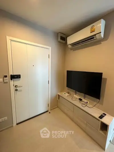 Modern living room with air conditioning and sleek TV setup