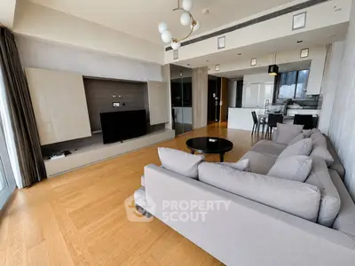 Spacious modern living room with open kitchen and elegant decor
