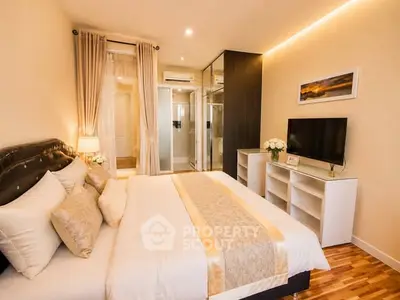 Luxurious bedroom with elegant decor and modern amenities, featuring a plush bed and stylish lighting.