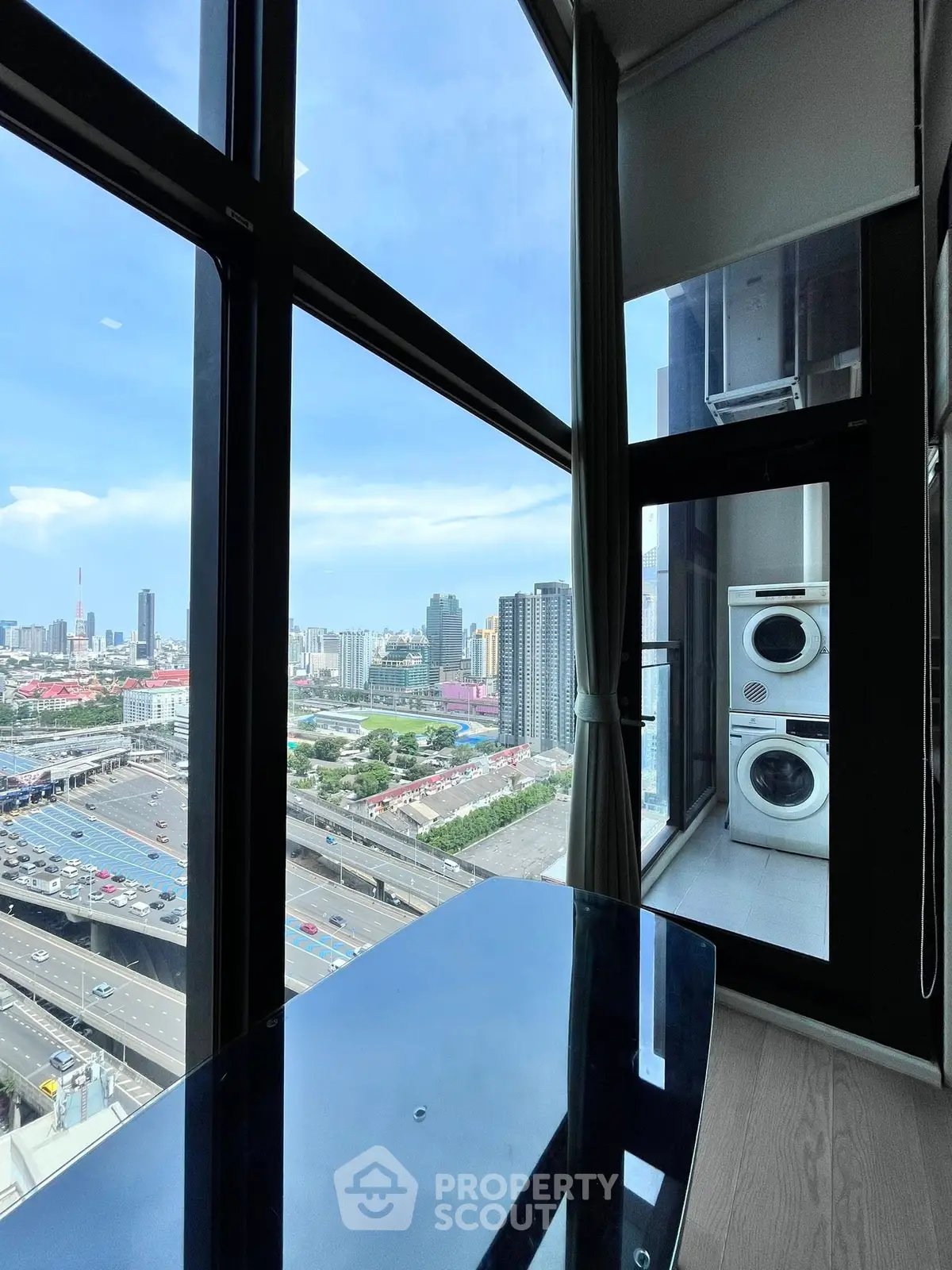 Stunning high-rise apartment with floor-to-ceiling windows and city view