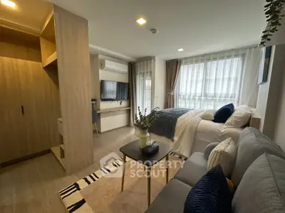 Modern studio apartment with cozy living area and stylish decor