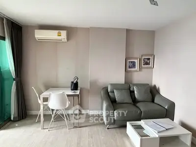 Modern living room with sleek furniture and natural light, perfect for urban living.