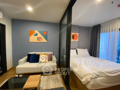 Modern bedroom with stylish decor and cozy seating area