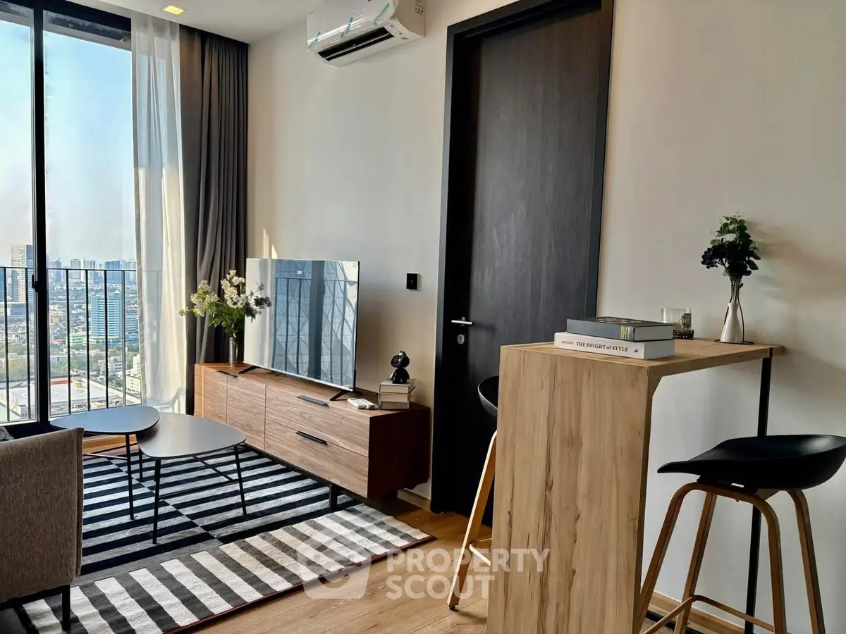 Modern living room with city view, stylish furniture, and natural light.