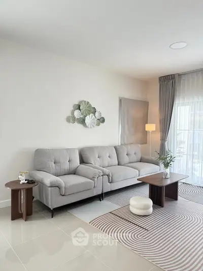 Modern living room with stylish gray sofa and elegant decor