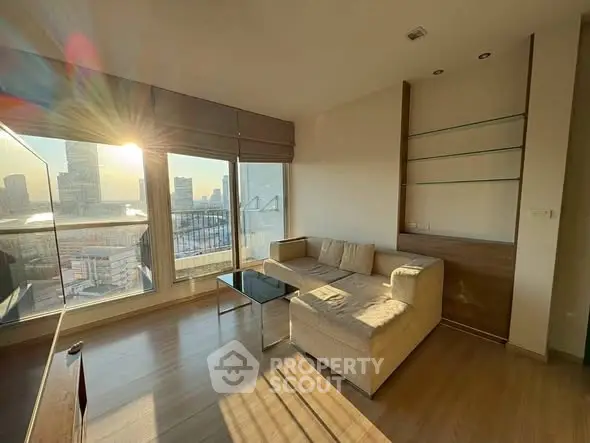 Sunlit modern living room with city view and cozy sectional sofa