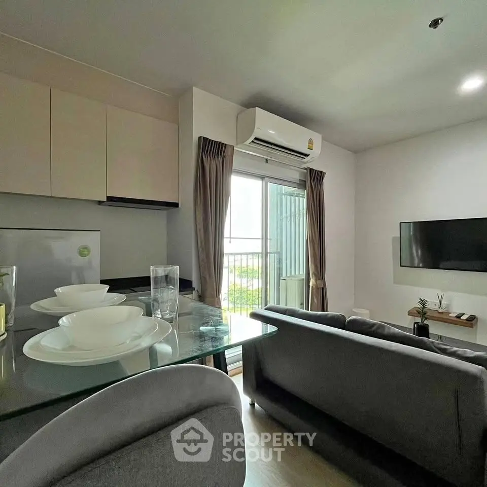 Modern living room with sleek furniture and natural light, perfect for urban living.