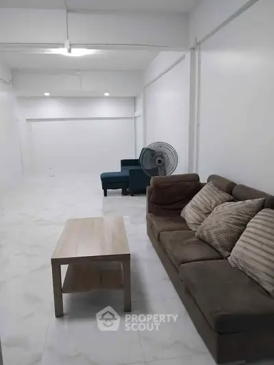 Spacious living room with modern furniture and minimalist design