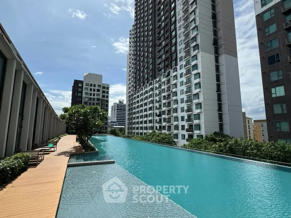Luxurious high-rise apartment with stunning rooftop pool and city views.