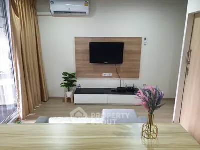Modern living room with wall-mounted TV and stylish decor