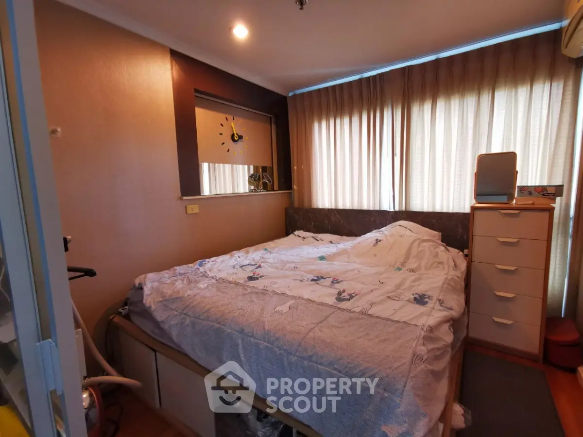 Cozy bedroom with natural light and modern decor