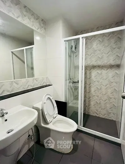 Modern bathroom with sleek shower and stylish tile design