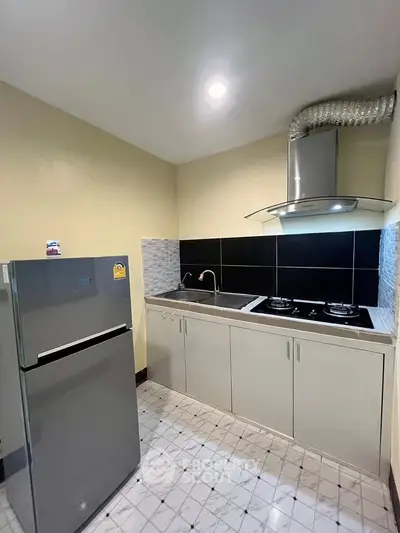 Compact kitchen with modern appliances and sleek cabinetry