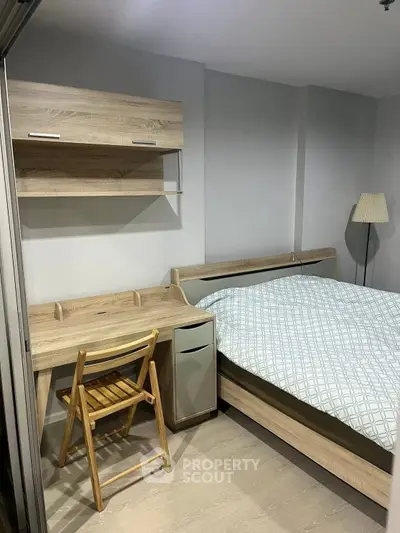 Cozy bedroom with modern wooden furniture and soft lighting, perfect for relaxation and comfort.