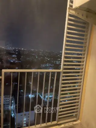 Stunning night cityscape view from a high-rise balcony, perfect for urban living enthusiasts.