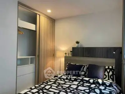 Modern bedroom with stylish decor and built-in wardrobe