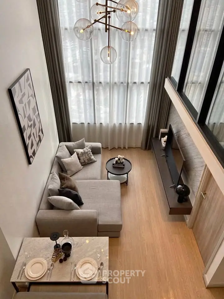 Stunning modern living room with high ceilings and elegant decor in a luxury apartment.