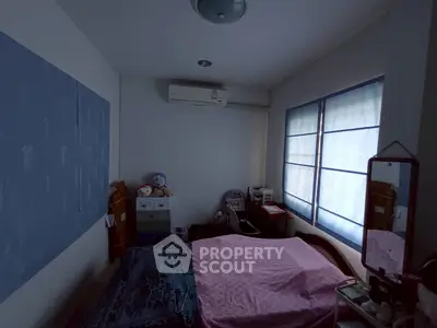 Cozy bedroom with air conditioning and natural light