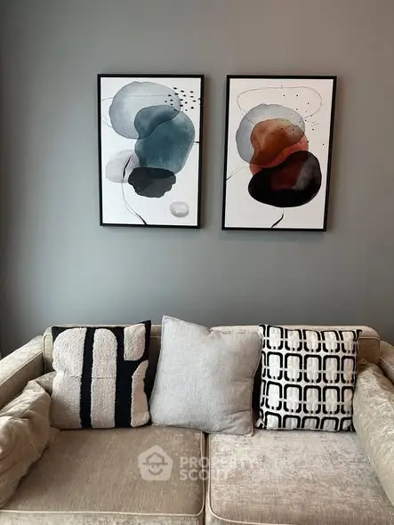 Stylish living room with modern art and cozy sofa, perfect for contemporary urban living.