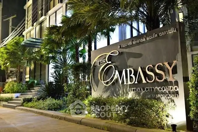 Luxurious entrance of The Embassy Pattaya City Condo with lush greenery and modern design.