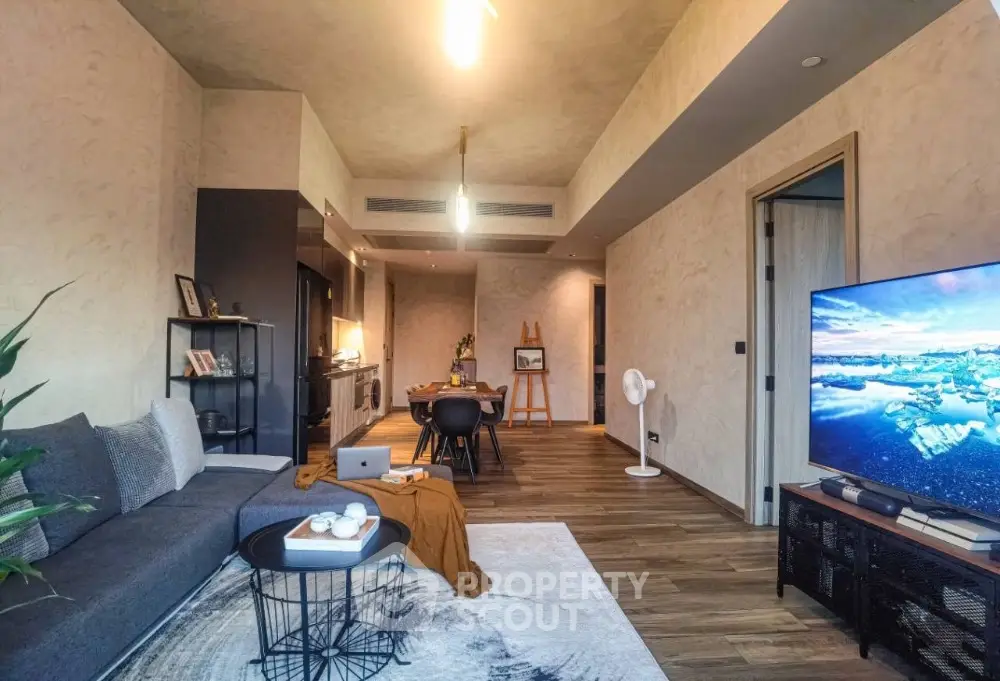 Stylish modern living room with open kitchen and cozy decor