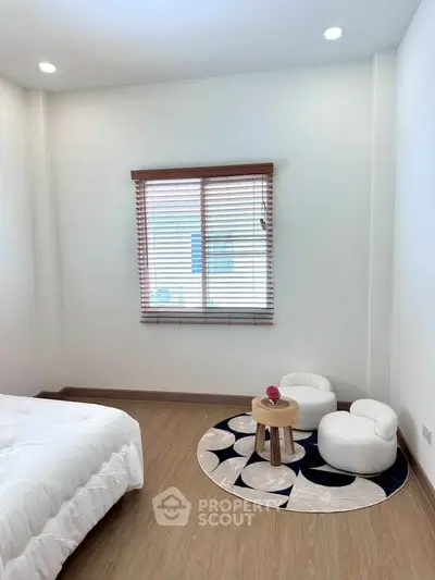 Cozy bedroom with modern decor and natural light