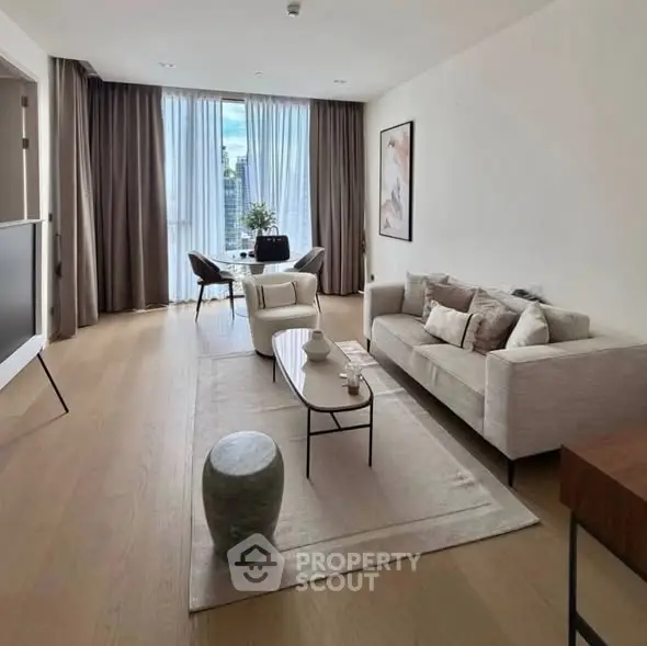 Elegant modern living room with floor-to-ceiling windows and stylish decor
