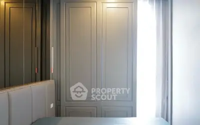 Modern bedroom with sleek built-in wardrobe and soft lighting