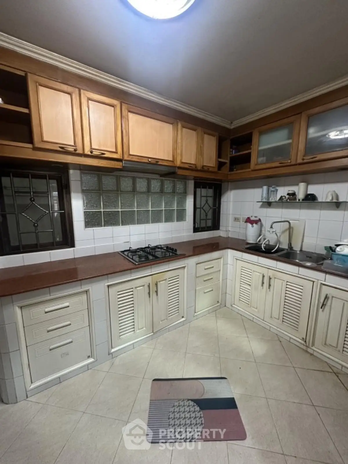 Spacious kitchen with gas stove and ample storage in modern home