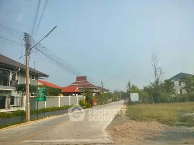 Charming suburban street with modern houses and lush greenery, perfect for family living.