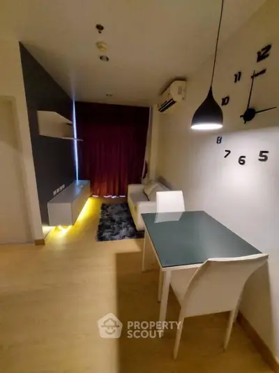 Modern living room with stylish decor and ambient lighting