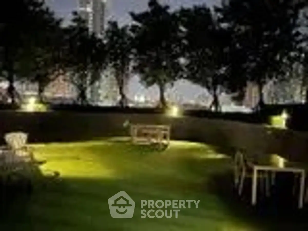 Stunning rooftop garden with city skyline view at night, perfect for relaxation and gatherings.