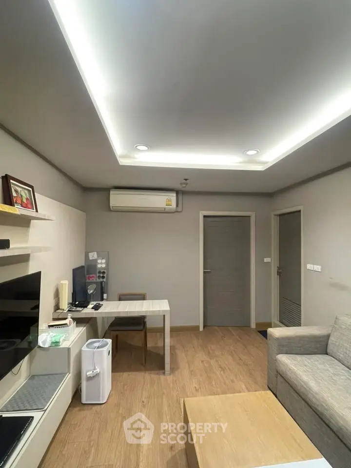 Modern living room with sleek design and cozy ambiance, featuring a stylish sofa and contemporary decor.