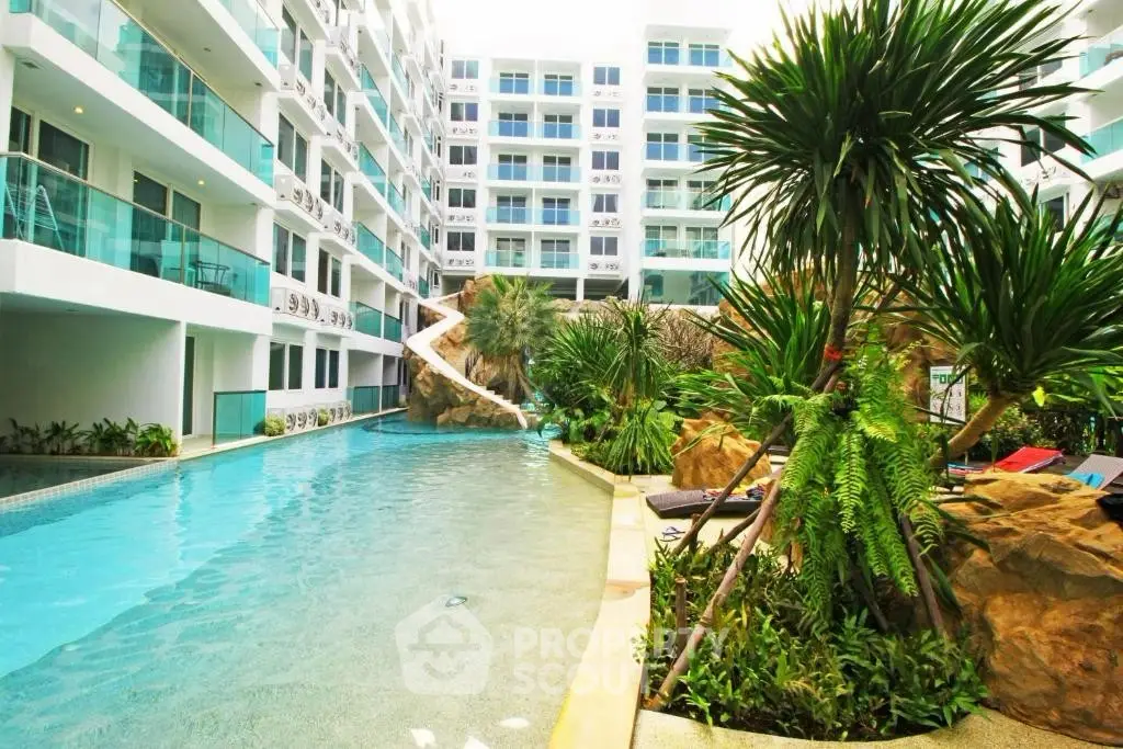 Luxurious condominium with stunning pool and lush greenery, perfect for resort-style living.