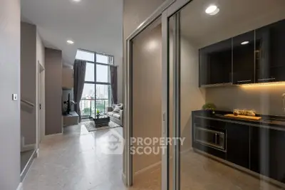 Modern apartment with open living room and sleek kitchen design