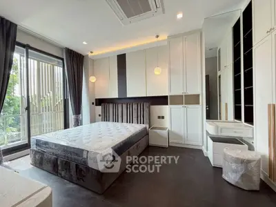 Luxurious modern bedroom with large windows and elegant furnishings